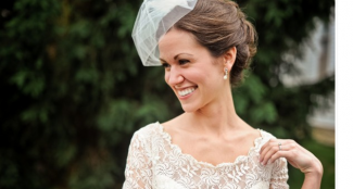 bride in birdcage veil and lace dress 