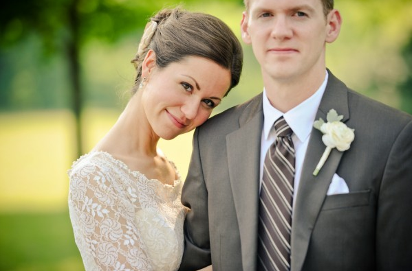 Bride in lace wedding dress with bridegroom 