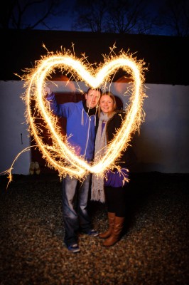 couple with sparklers in shape of heart 