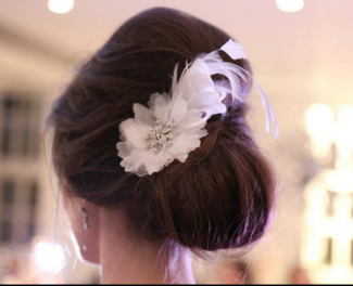 wedding hair updo with feathers