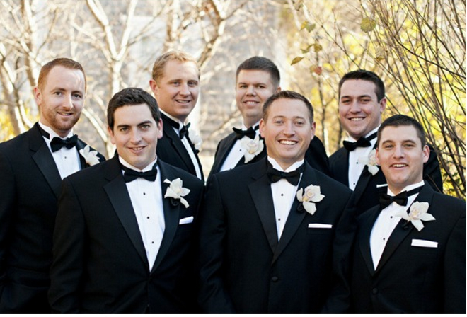 groomsmen with black tuxedos 