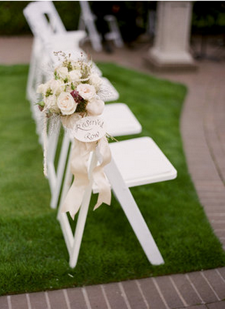 white decorated chairbacks with flowers