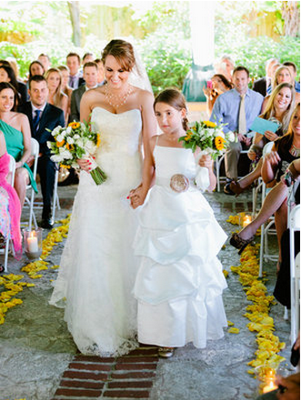 bride and bridesmaid holding sunflowers