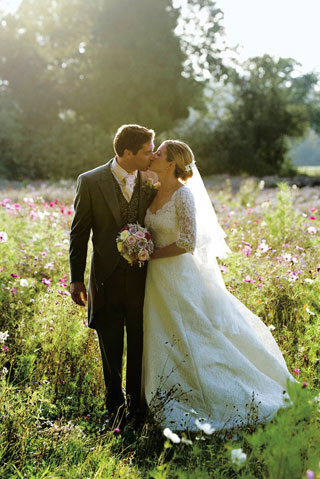 bride and groom in country flower meadow 