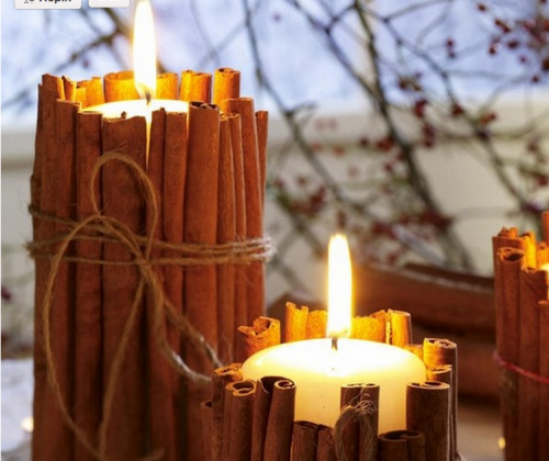 winter candles with cinnamon sticks 