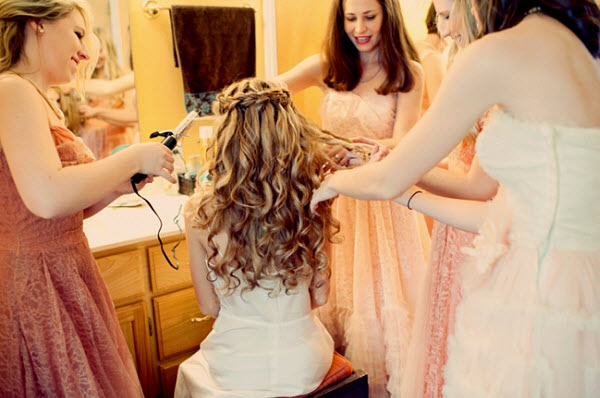 bride getting hair fixed