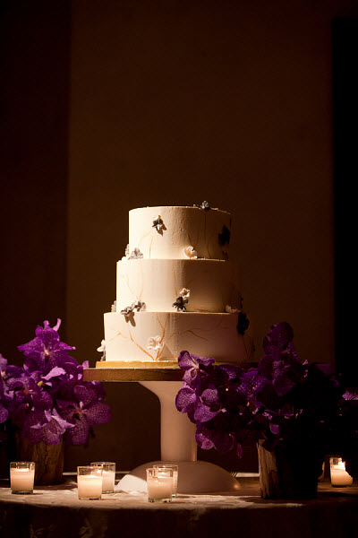 wedding cake with purple flowers