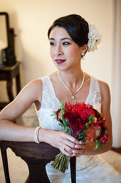 bride with red bouquet