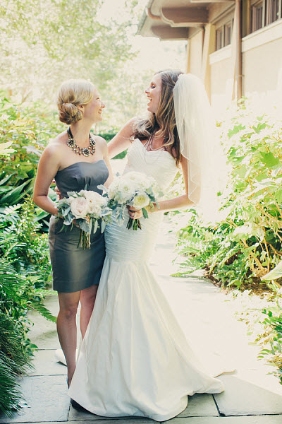 bride and bridesmaid in gray