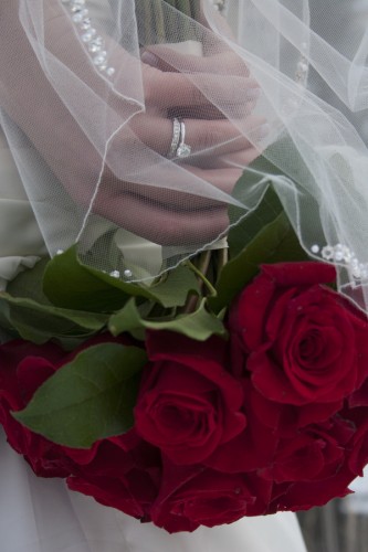 bride with red roses wedding bouquet 