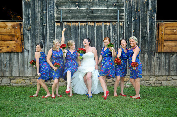 bride with bridesmaids in blue and red