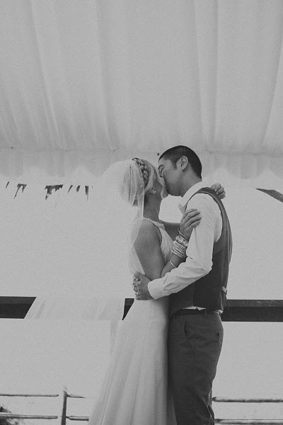 bride and groom first kiss