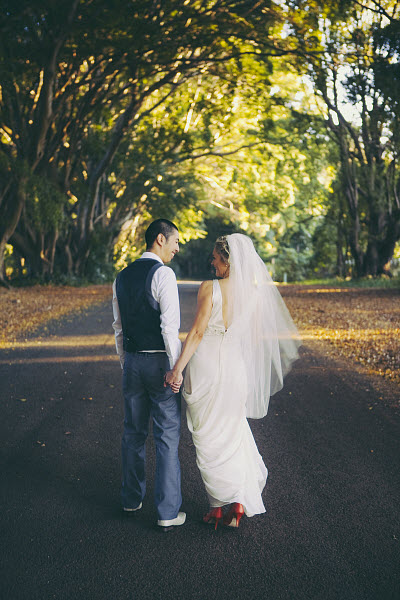 bride and groom holding hands