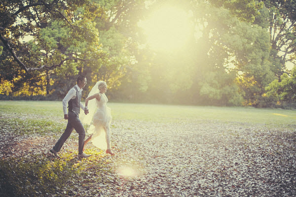 bride and groom running