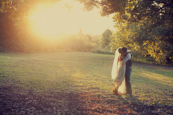 bride and groom at sunset