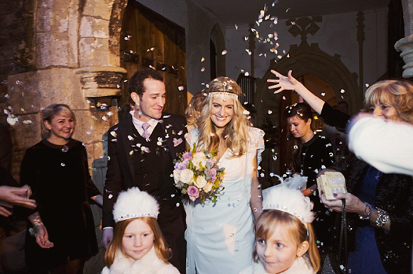 bride and groom being covered in confetti