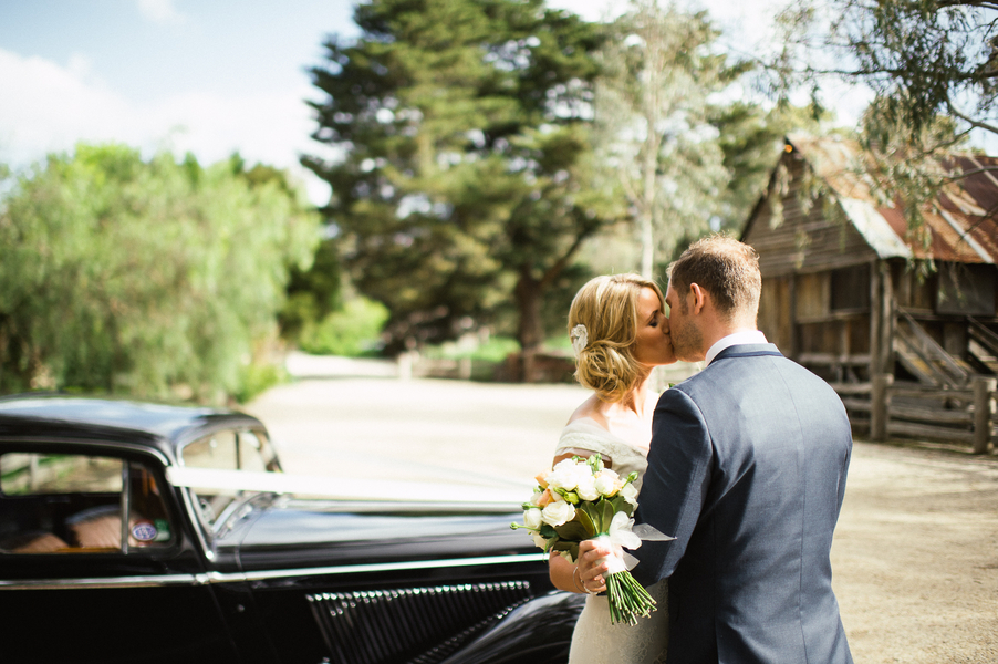 bride and groom kissing at wedding 