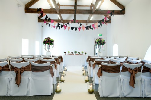 bunting decorating wedding aisle 