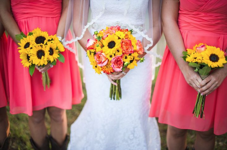 Sunflowers with coral from rusticweddingchic.com